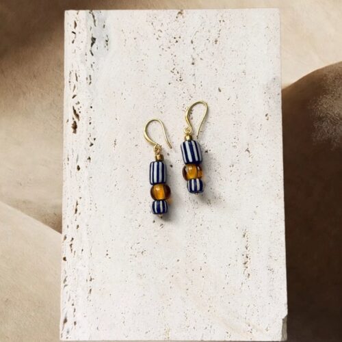 Gold-tone hook earrings with indigo striped glass and amber beads by E-SHOO