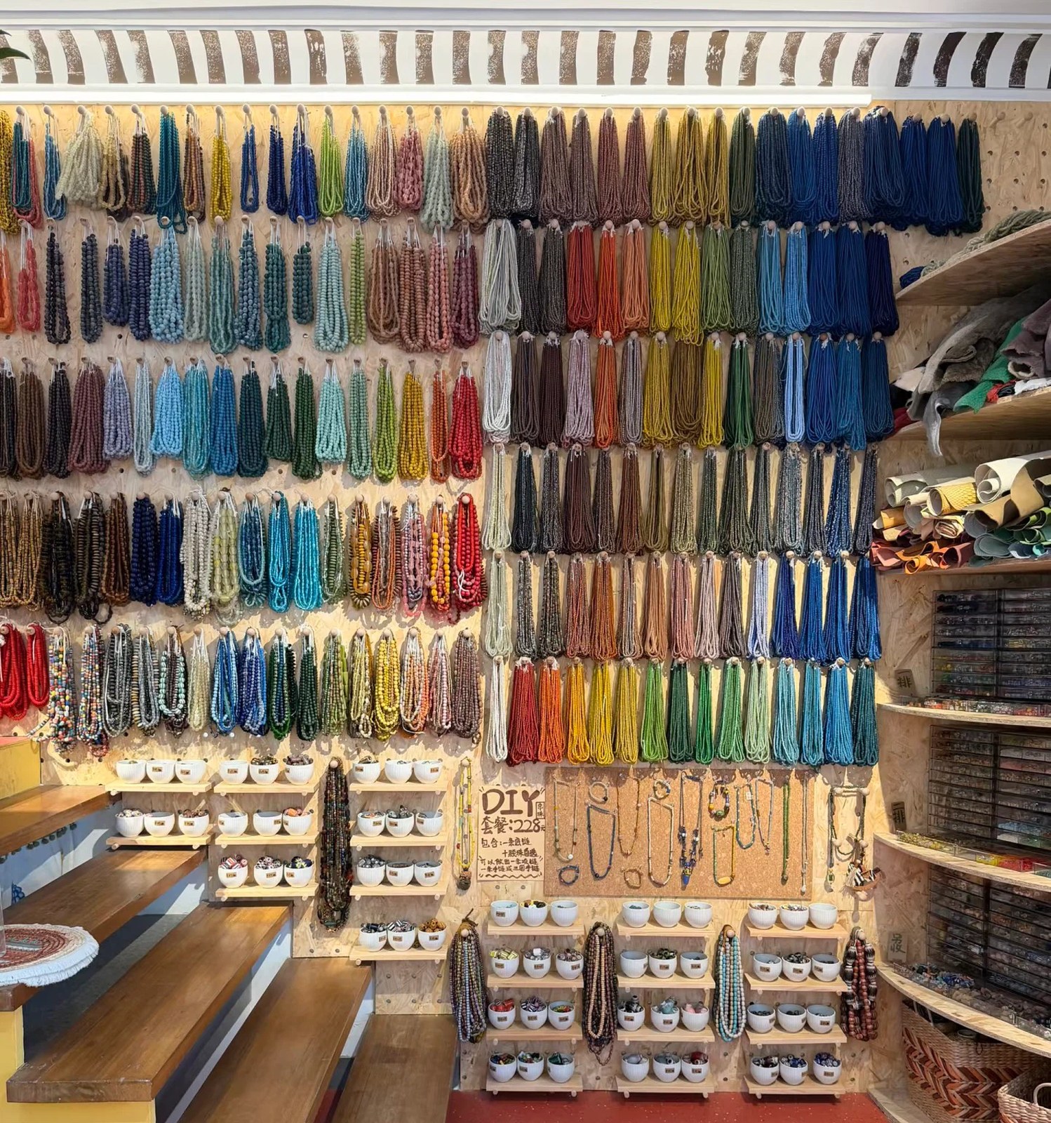 A wall of beads sorted by colour in the E-Shoo Shanghai studio